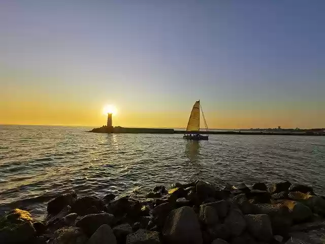 Free download Sailboat Sunset Lighthouse -  free photo or picture to be edited with GIMP online image editor