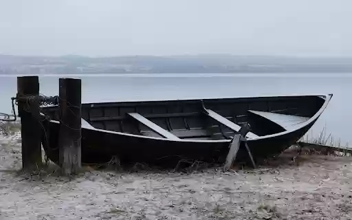 Abandoned Boat Near Lake in Wintry  from Chrome web store to be run with OffiDocs Chromium online