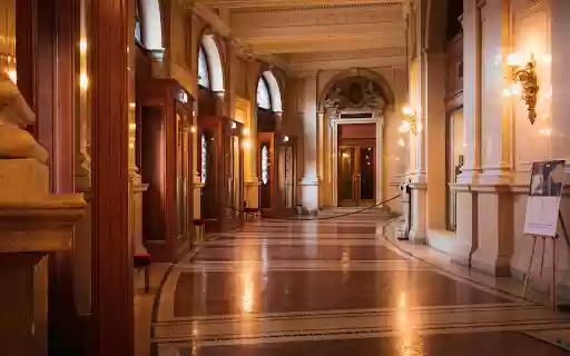 A long hallway with ornate columns and doors  from Chrome web store to be run with OffiDocs Chromium online