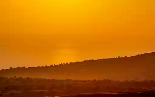 A Picturesque Sunset over a Landscape  from Chrome web store to be run with OffiDocs Chromium online