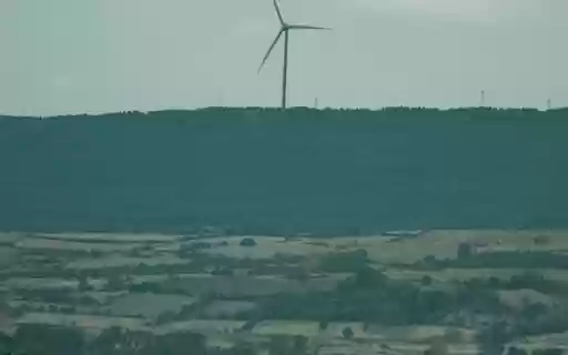 A Wind Turbine near a Rural Area  from Chrome web store to be run with OffiDocs Chromium online