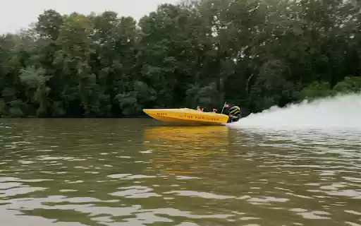A yellow speed boat is speeding through the water  from Chrome web store to be run with OffiDocs Chromium online