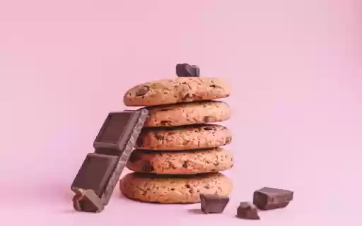 Four Chocolate Chip Cookies Stacked on a Pink Background from Chrome web store to be run with OffiDocs Chromium online Four Chocolate Chip Cookies Stacked on a Pink Background from Chrome web store to be run with OffiDocs Chromium online