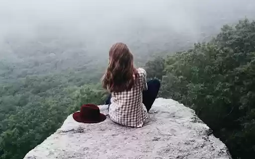 Girl sitting on a rock  from Chrome web store to be run with OffiDocs Chromium online