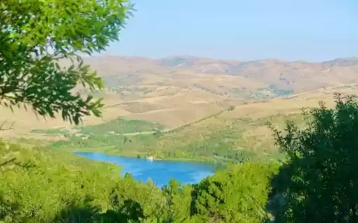 Green lake between mountains and hills  from Chrome web store to be run with OffiDocs Chromium online