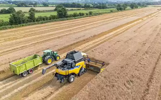 Harvester and tractor go side by side  from Chrome web store to be run with OffiDocs Chromium online