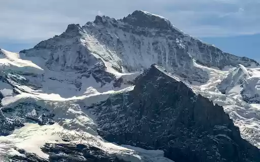 High Mountains Covered in Snow  from Chrome web store to be run with OffiDocs Chromium online