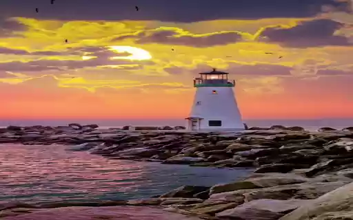 Lighthouse at sunset wallpaper  from Chrome web store to be run with OffiDocs Chromium online