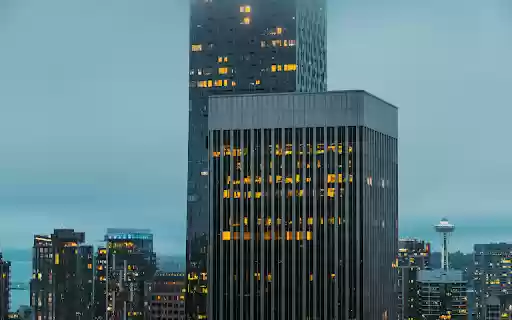 Lights in Windows of Glass Skyscrapers in City  from Chrome web store to be run with OffiDocs Chromium online