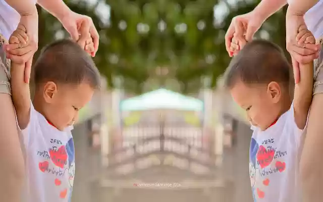 Little boy holding his mothers hand.  from Chrome web store to be run with OffiDocs Chromium online