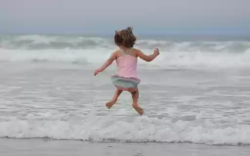 Little girl bathing in the sea  from Chrome web store to be run with OffiDocs Chromium online