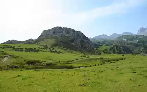 Mountains and green grass hills  from Chrome web store to be run with OffiDocs Chromium online