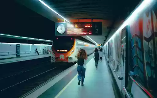 People Walking on Platform at Railway Station  from Chrome web store to be run with OffiDocs Chromium online