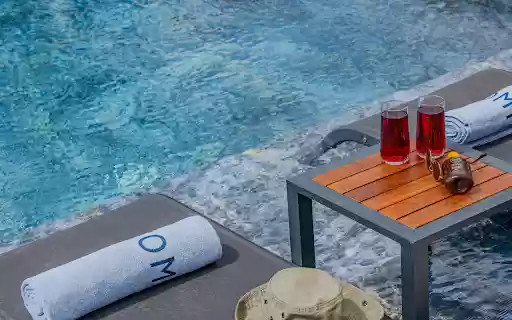 Red Drinks on a Poolside Table  from Chrome web store to be run with OffiDocs Chromium online