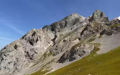 Rocky mountains and mossy grass  from Chrome web store to be run with OffiDocs Chromium online