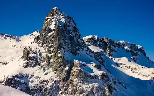 Snowy Mountains and Blue Sky  from Chrome web store to be run with OffiDocs Chromium online