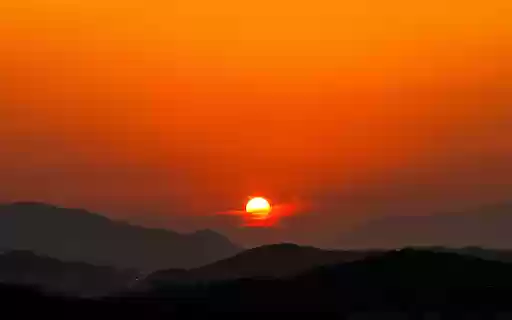 The sun behind the mountain  from Chrome web store to be run with OffiDocs Chromium online
