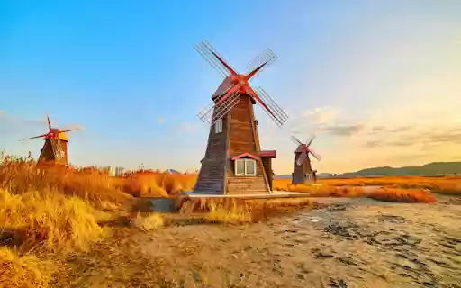 Whimsical Windmills in a Golden Landscape  from Chrome web store to be run with OffiDocs Chromium online