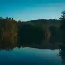 Serene Lake Landscape with Forest Reflections at Dawn  screen for extension Chrome web store in OffiDocs Chromium