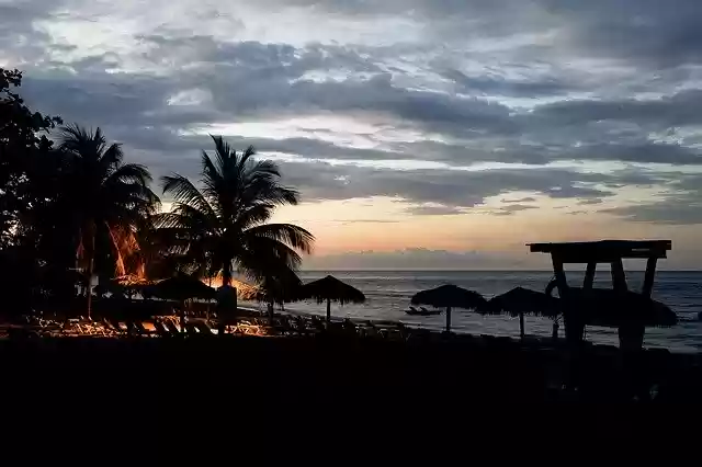 Безкоштовно завантажте Sunset Beach Tropical - безкоштовне фото або зображення для редагування за допомогою онлайн-редактора зображень GIMP