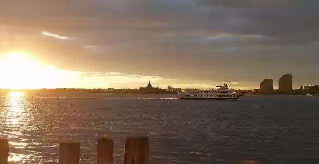 Free download Sunset Boat Newyork Stature -  free photo or picture to be edited with GIMP online image editor