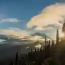 Tela de loop do pôr do sol no pico Naches do Monte Rainier para extensão da Chrome Web Store no OffiDocs Chromium