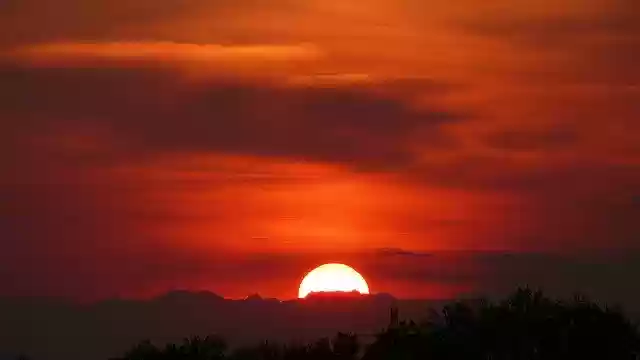 Free download Sunset Sky Sun The Mountains Far -  free photo or picture to be edited with GIMP online image editor