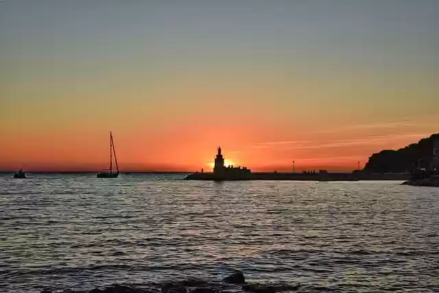 Free download sun sunset dusk sea lighthouse free picture to be edited with GIMP free online image editor