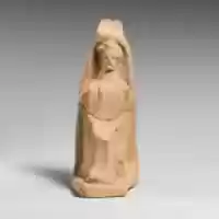 Free download Terracotta statuette of a seated female figure free photo or picture to be edited with GIMP online image editor