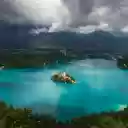 The lake bled is surrounded by green mountains  screen for extension Chrome web store in OffiDocs Chromium