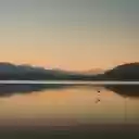 Tranquil Sunset Over Mountain Lake  screen for extension Chrome web store in OffiDocs Chromium