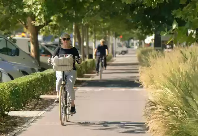 Free download woman old cycling the sidewalk free picture to be edited with GIMP free online image editor