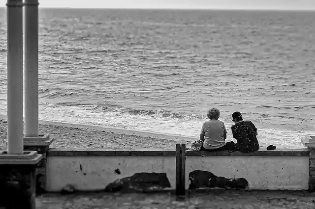 Free download Women Seashore Sitting -  free photo or picture to be edited with GIMP online image editor